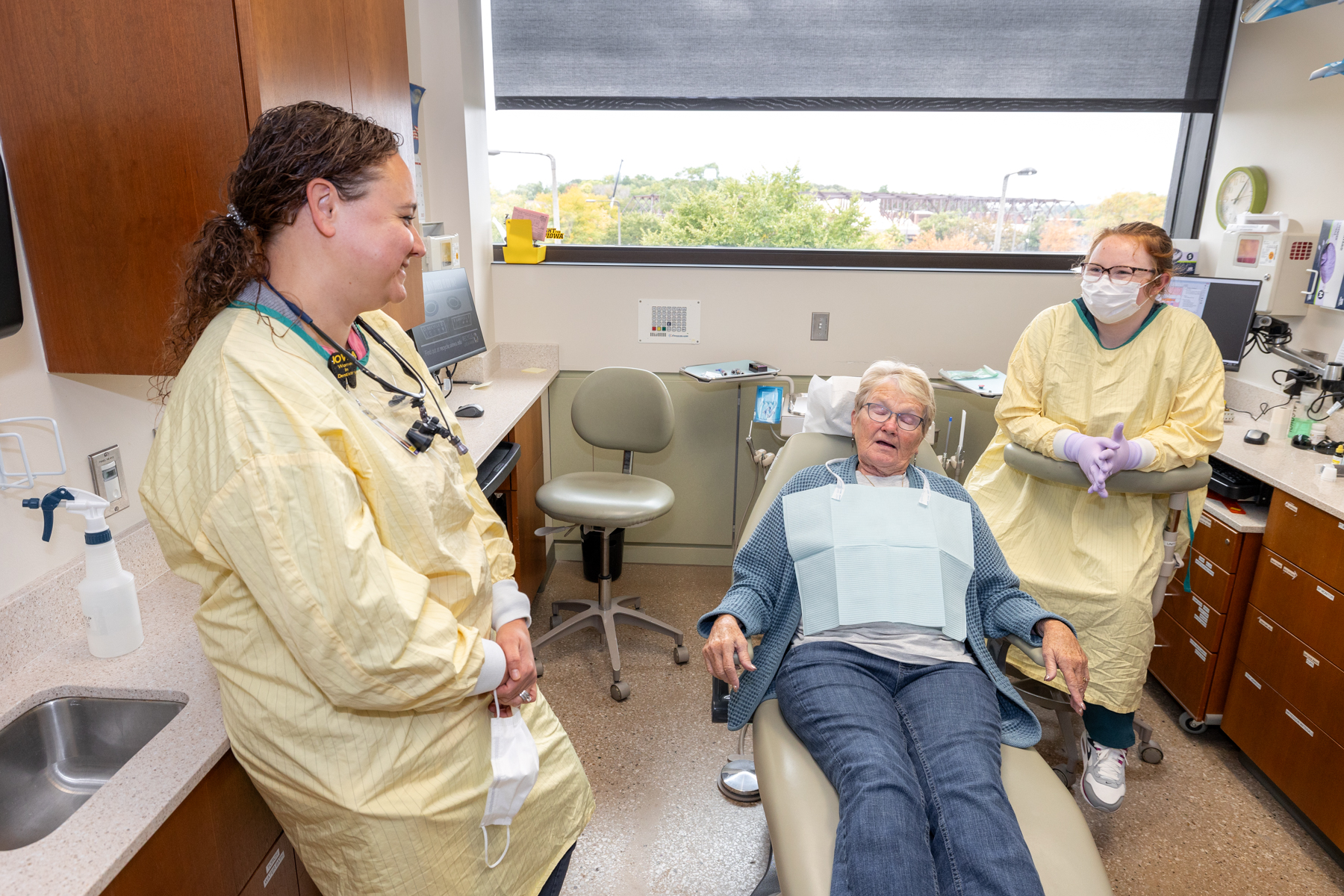 Dr. Hartshorn talks to a patient during a visit to the college.