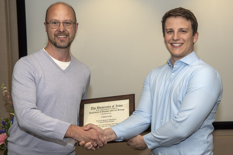 Colton Curtis receiving his award