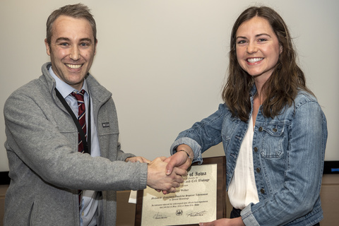 Sydney Weber receiving her award