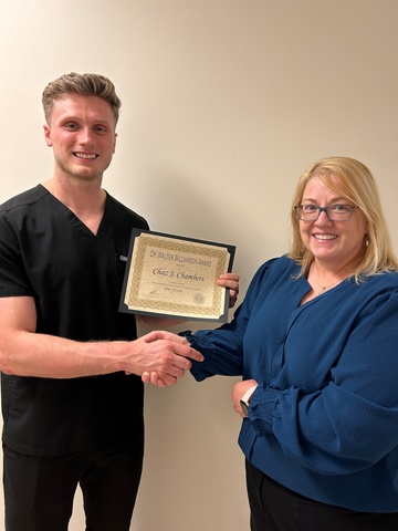 Chaz Chambers receiving operative dentistry award