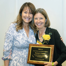 Karin Weber-Gasparoni and Kecia Leary pose for a photo after Leary was presented the 2024 Dental Educator of the Year award at the 2024 Alumni Reception.