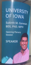 A poster promoting Ganesan's plenary address