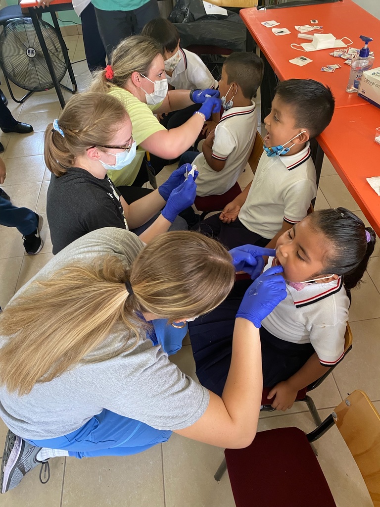 Isabel Wolfe, Alanna Bram, and Mariah Oyeh providing dental care in Mexico