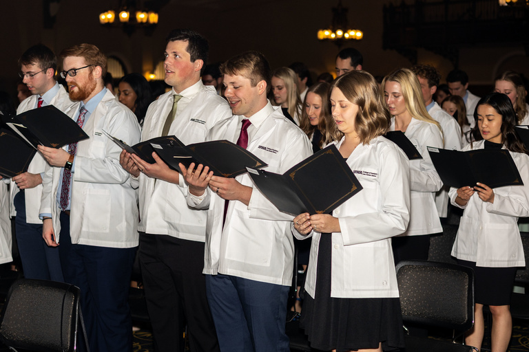 Students reciting the dental oath at the 2023 White Coat Ceremony