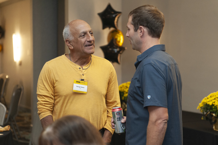 George Hanna chats with an alum at the 2023 Alumni Reunion at the Radisson Hotel.