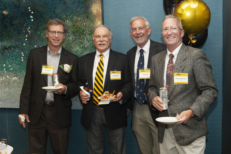 Dan Caplan, Mike Colbert, Craig Howe, and Michael McGowan pose for a photo at the 2023 Alumni Reunion at the Radisson Hotel.
