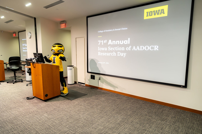 Herky at the podium on research day