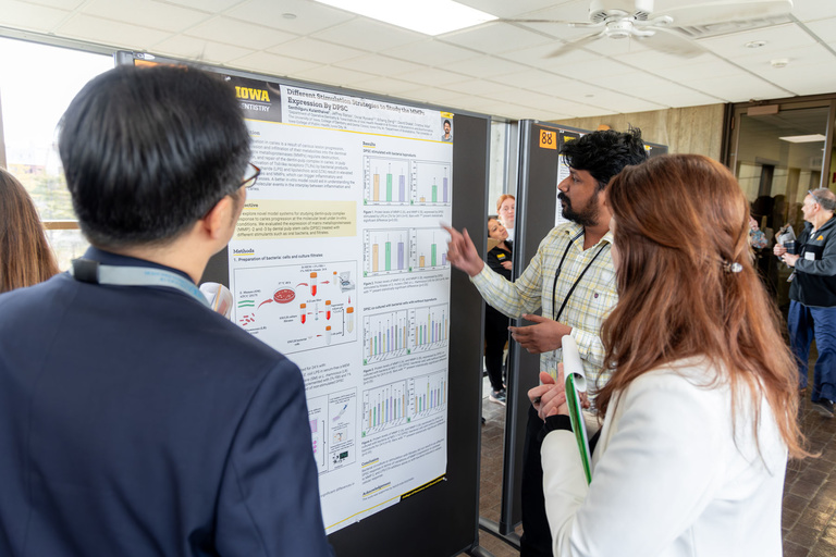 Senthilguru Kulanthaivel presents his research poster during the 2024 AADOCR Research Day.