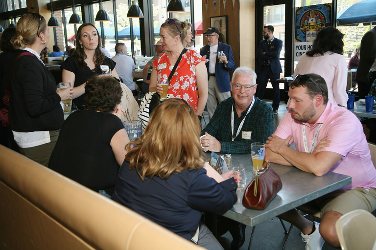 The UI College of Dentistry hosted an alumni reception at the Iowa Athletic Club Restaurant. These are pictures of attendees during the event.