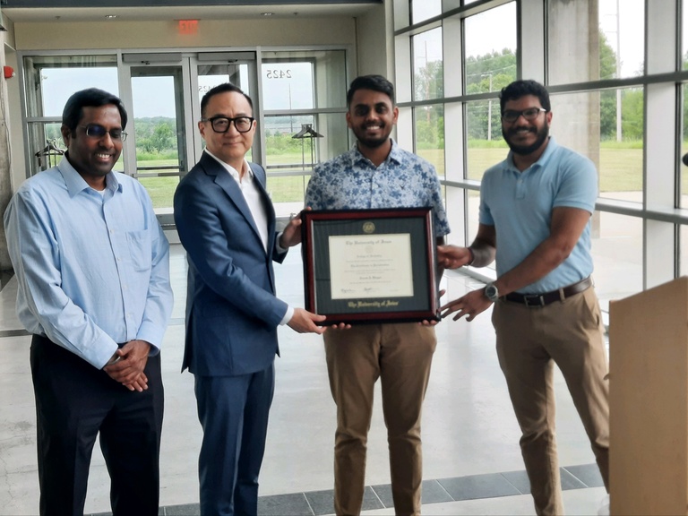 The Department of Periodontics held a celebration of its graduates at the Iowa Athletics Hall of Fame. This is a photo of the two graduates, department head Sivaraman Prakasam and Dr. Kan.