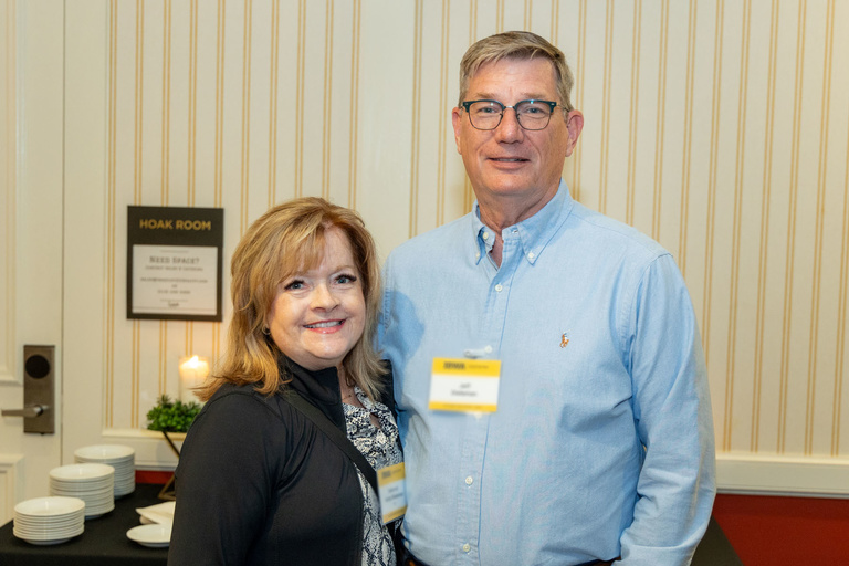 Two alumni pose for a picture at the 2024 Alumni Reception at The Graduate Hotel.