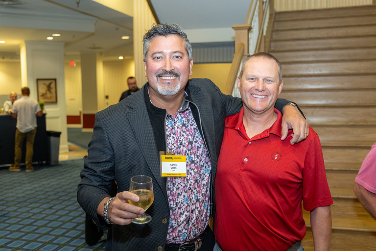 Two alumni pose for a picture at the 2024 Alumni Reception at The Graduate Hotel.