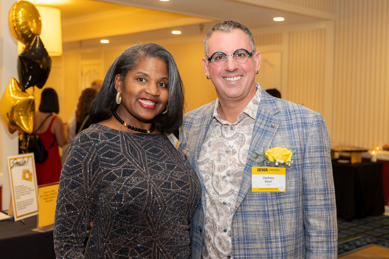 Hayley Harvey and Zach Kouri take a picture together during cocktail hour of the alumni reception.