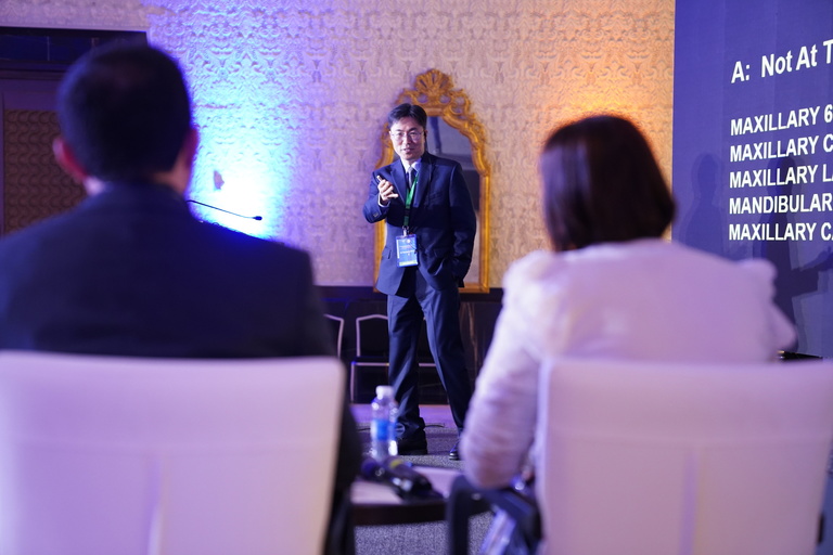 Shin speaking during his keynote lecture.