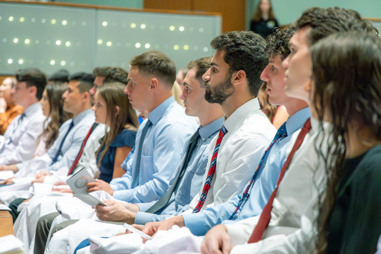 Picture of students sitting at White Coat Ceremony Fall 2024