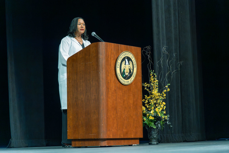 Picture of Associate Dean Sherry Timmons speaking at White Coat Ceremony Fall 2024