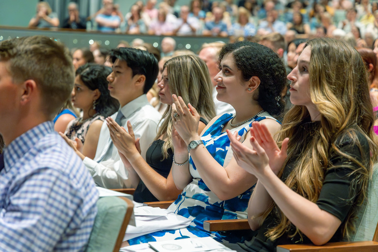 Picture of students applauding at White Coat Ceremony Fall 2024