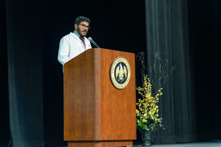 Picture of Dr. Ganesan speaking at White Coat Ceremony Fall 2024