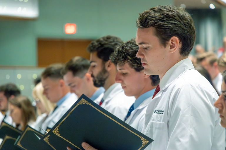 Picture of students reading the Dental Oath at White Coat Ceremony Fall 2024