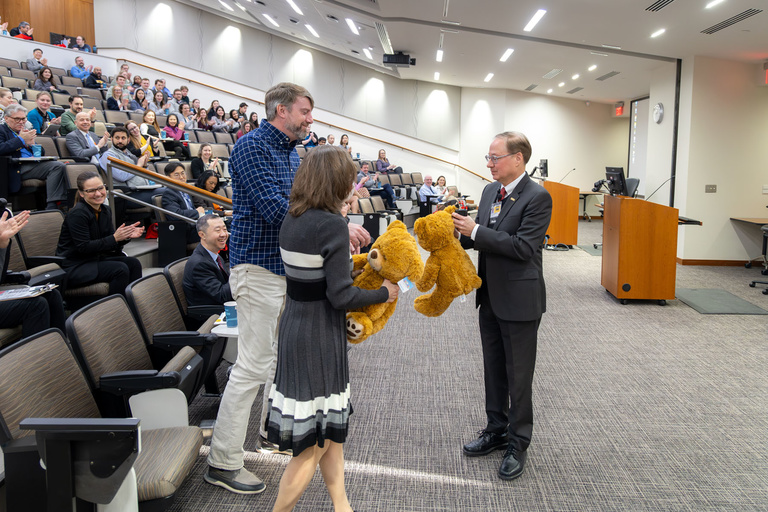 Dean Stanford continues his tradition of presenting teddy bears to faculty and staff as a symbol of their hard work and determination to achieving success.