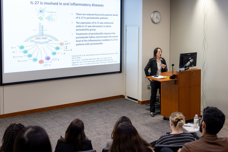 An oral presentation is conducted in Galagan Auditorium.