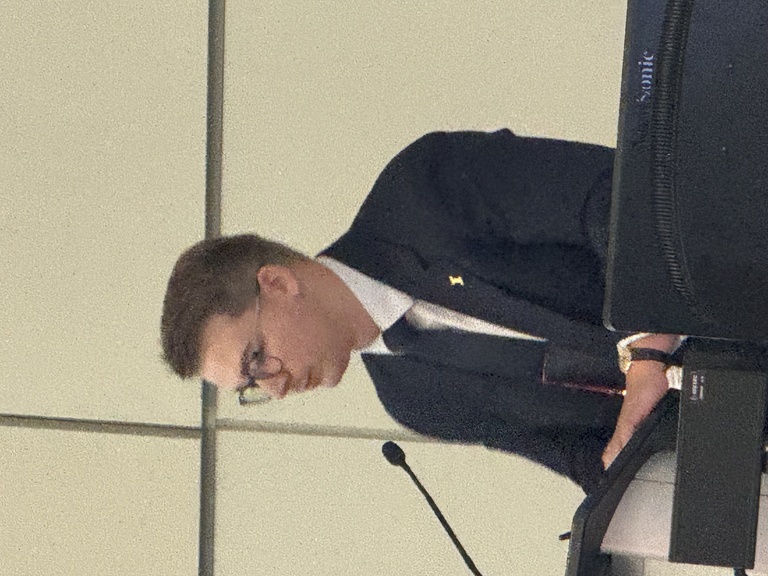 Bobera speaking at the AAP meeting.