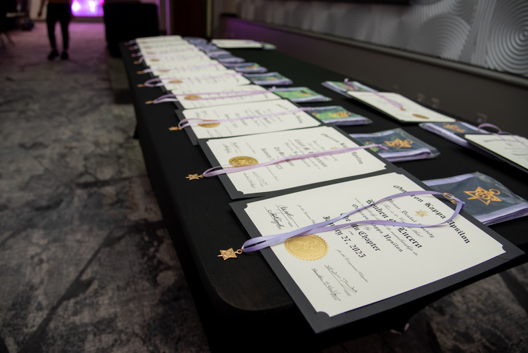 Award plaques and medals for the 2025 OKU award winners