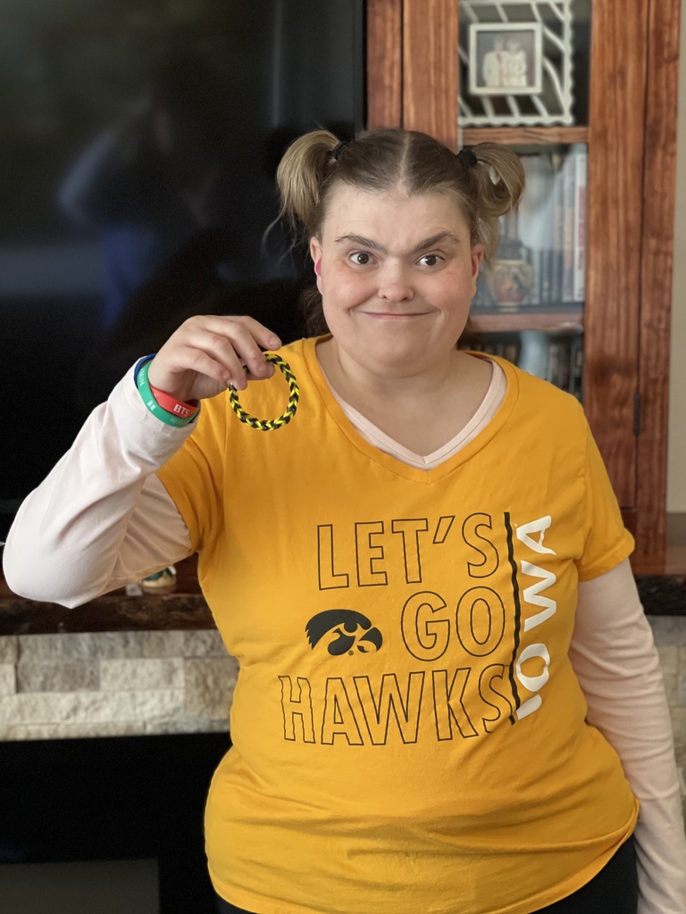 Nathalia donning black and gold and supporting the Hawkeyes