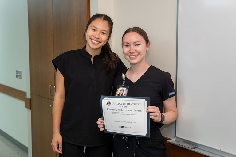 Student receiving Research Achievement Award
