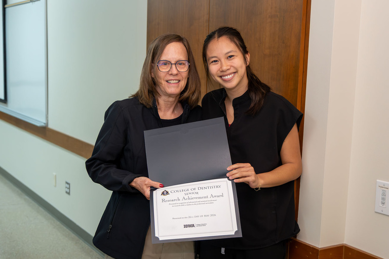 Student receiving Research Achievement Award