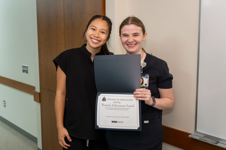 Student receiving Research Achievement Award