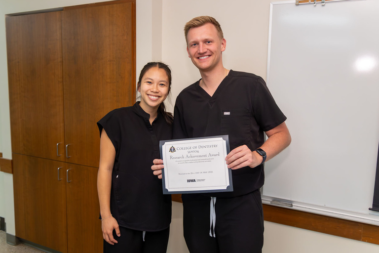 Student receiving Research Achievement Award