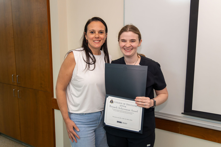 Student receiving Research Achievement Award