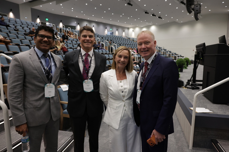 Ganesan takes a picture after his plenary address will colleagues