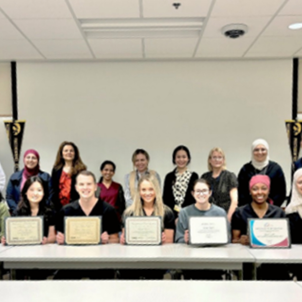 The Department of Prosthodontics poses for a photo after the student award luncheon on May 14, 2024