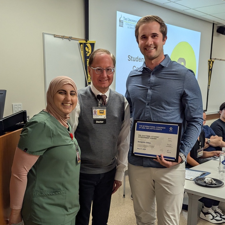 Pre-Doctoral Student Achievement award winner Ben Gilles poses with pros faculty.