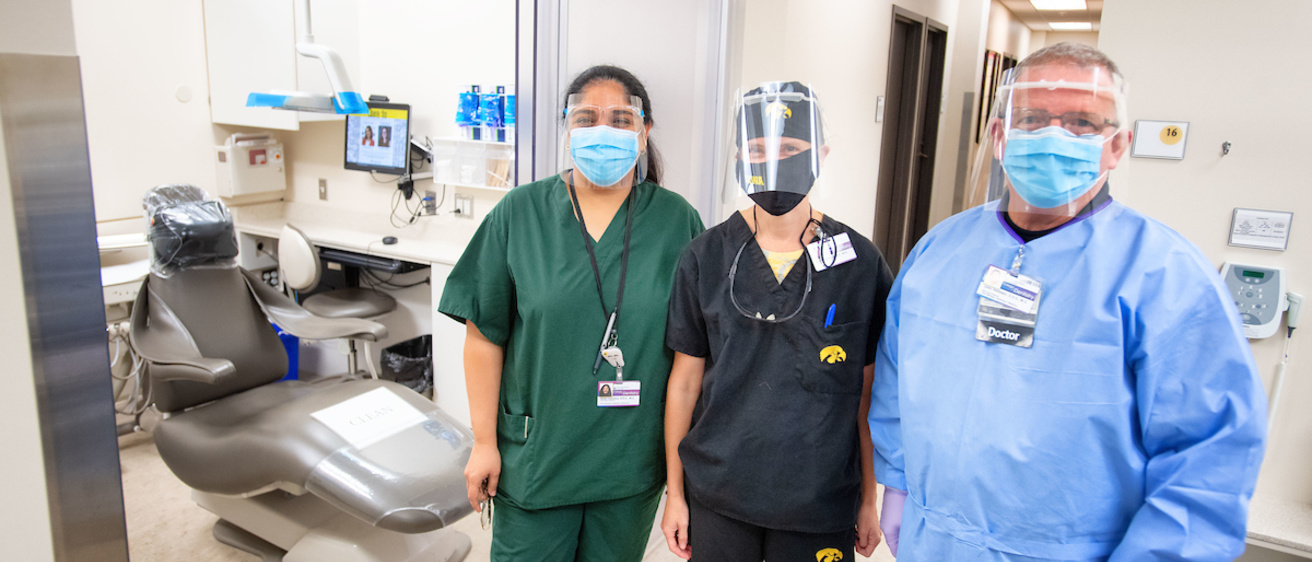 Dentists and staff with PPE equipment