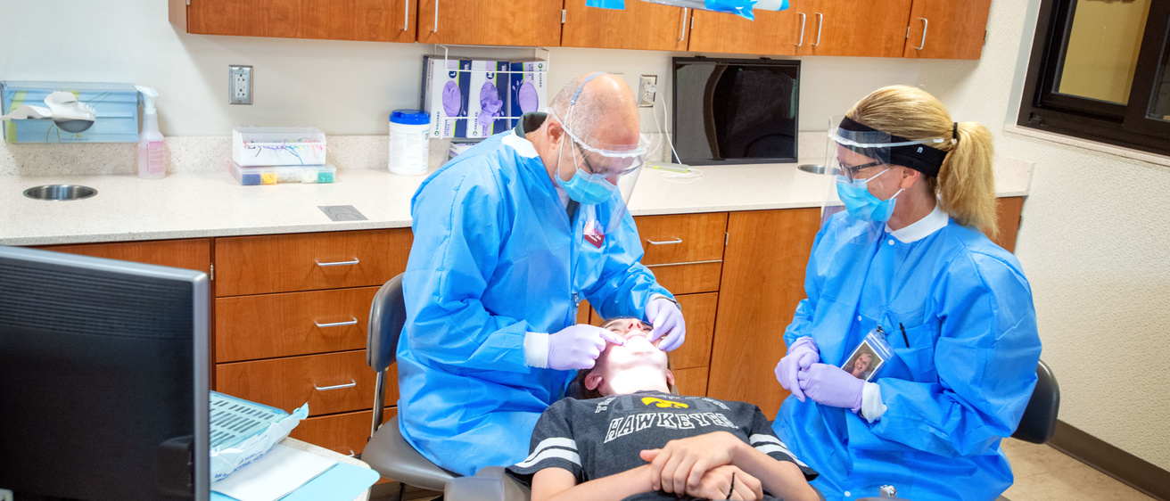 Orthodontists working on a patient during an appointment. 
