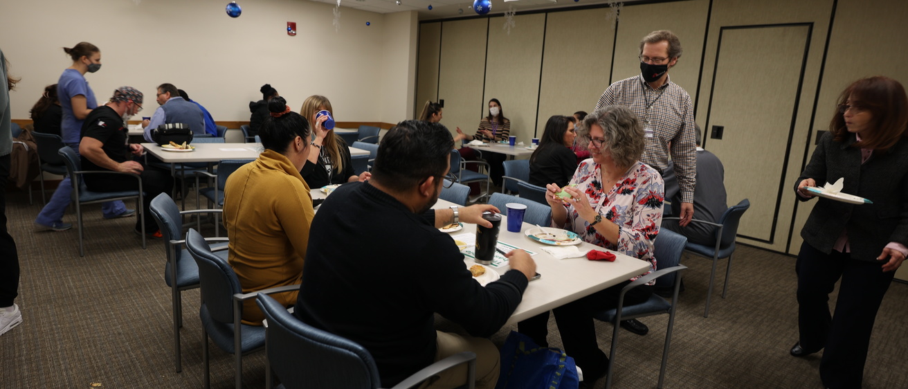 College of Dentistry faculty, staff, students, and residents attending the International Potluck