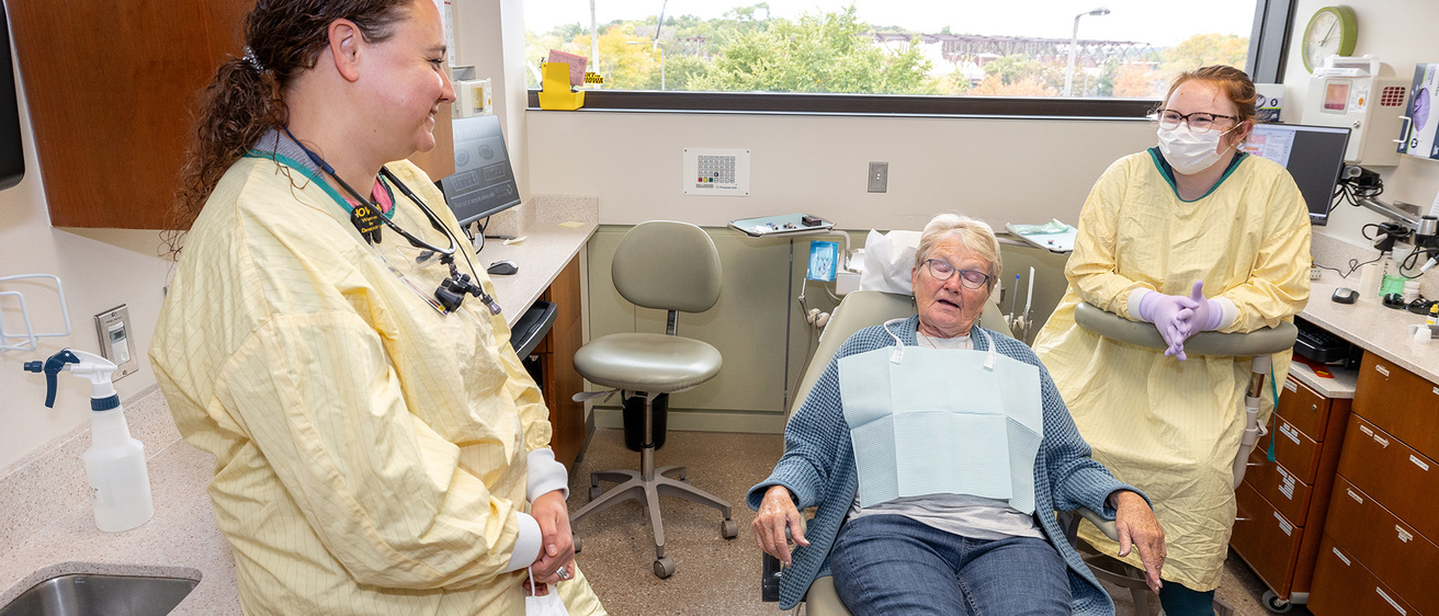 Dr. Jennifer Hartshorn meets with a patient in the clinic.