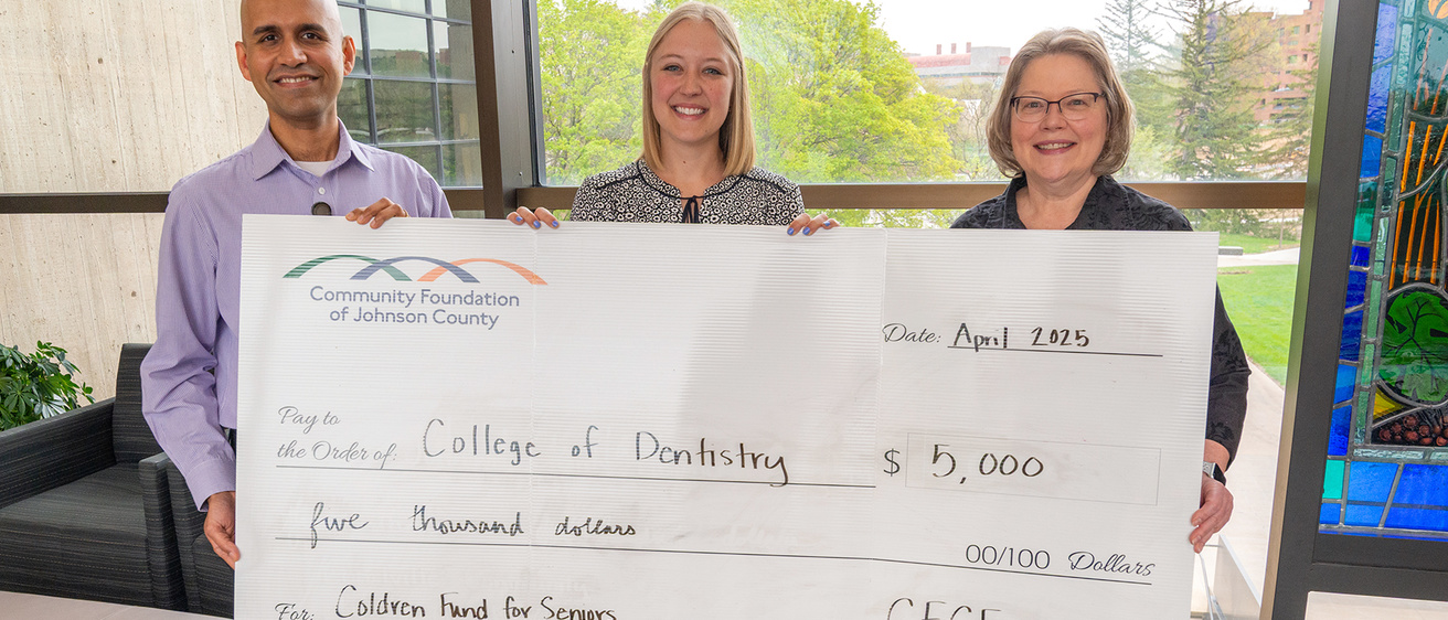 Rohit Nair posts with Diane Johnson and Ellie Moore from the Community Foundation of Johnson County.