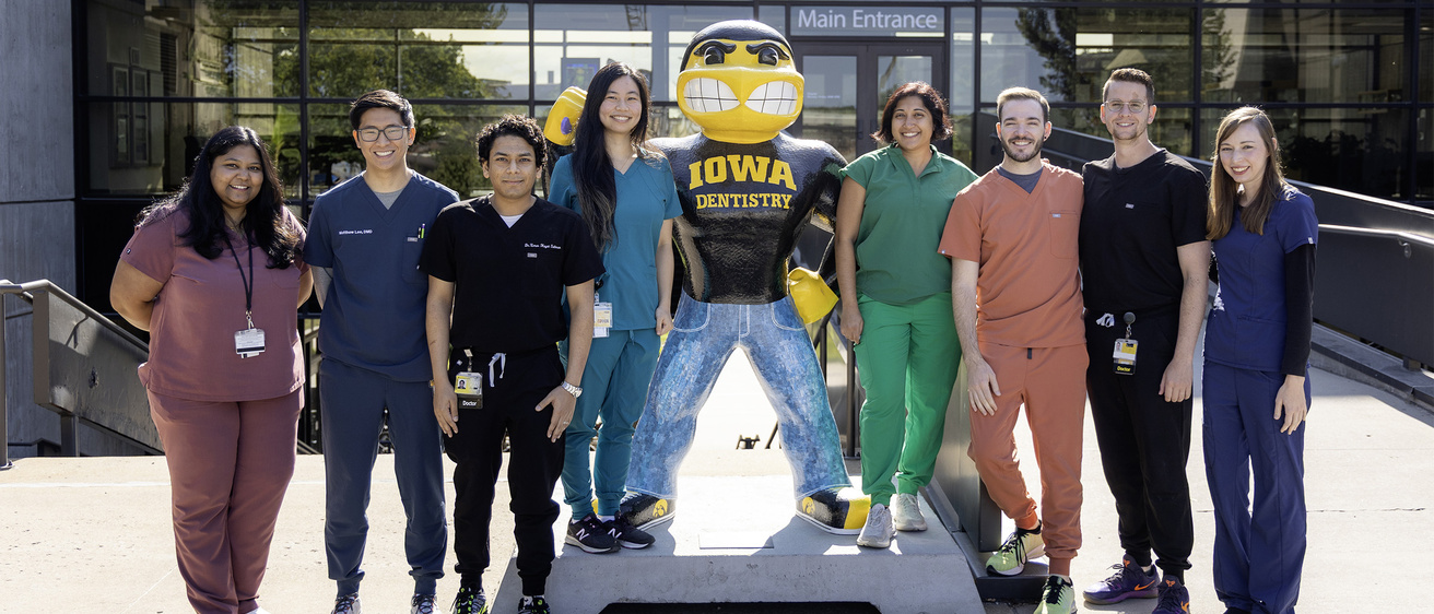 Department of Periodontics resident group photo with Herky statue.