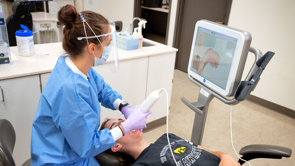 Orthodontic resident scanning teeth