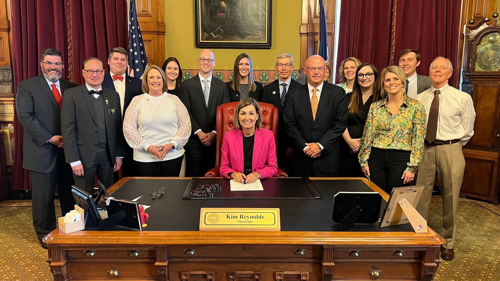 Iowa dentistry leaders with Governor Kim Reynolds at a bill signing