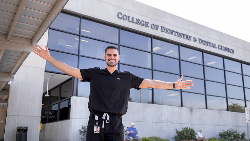 Jorge Ceballos standing outside the College of Dentistry