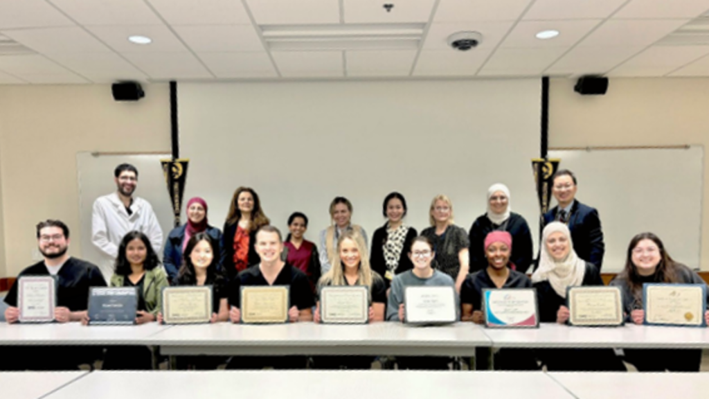 The Department of Prosthodontics poses for a photo after the student award luncheon on May 14, 2024
